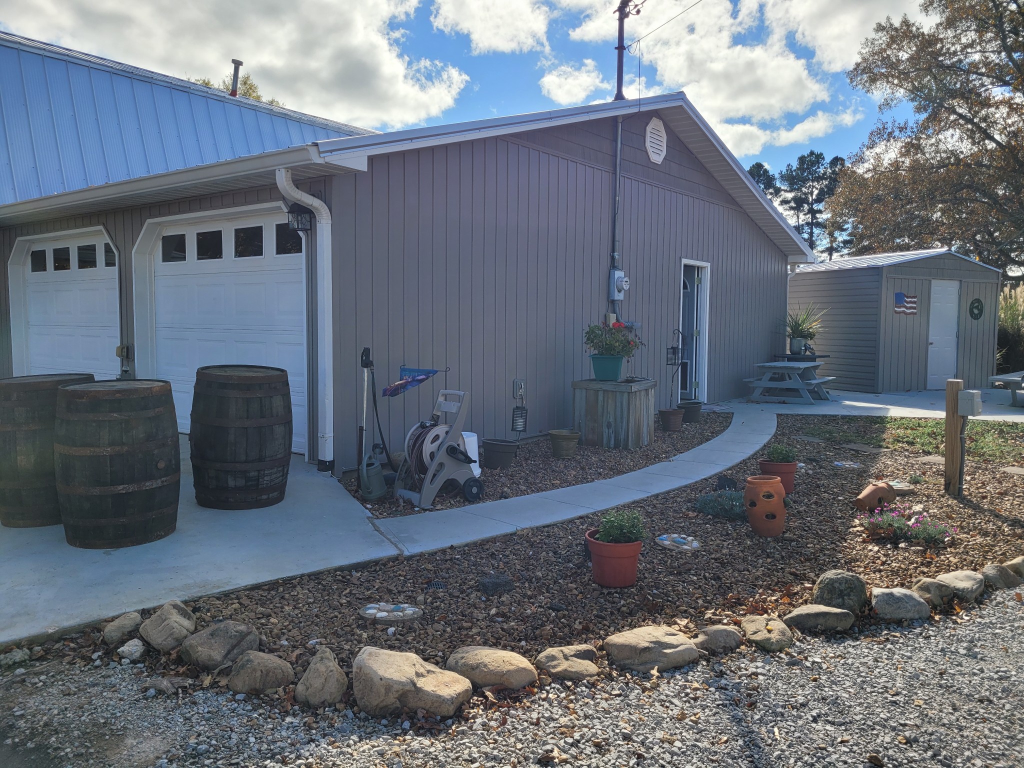 196 Nate Floyd Road Manchester, TN 37355 - Photo 33 of 36 a backyard of a house with barbeque oven table and chairs