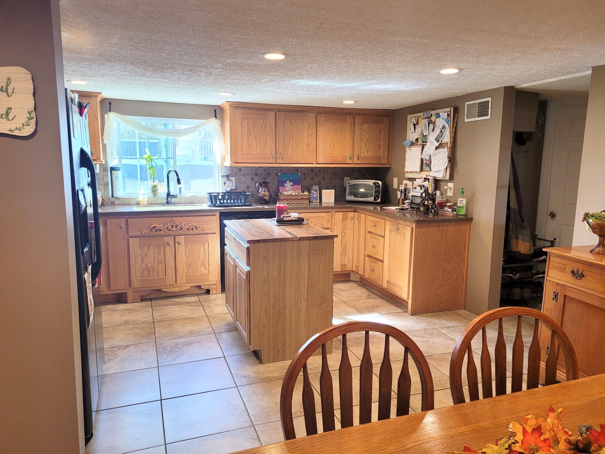 196 Nate Floyd Road Manchester, TN 37355 - Photo 5 of 36 a kitchen with stainless steel appliances granite countertop a refrigerator a stove top oven a sink and dishwasher