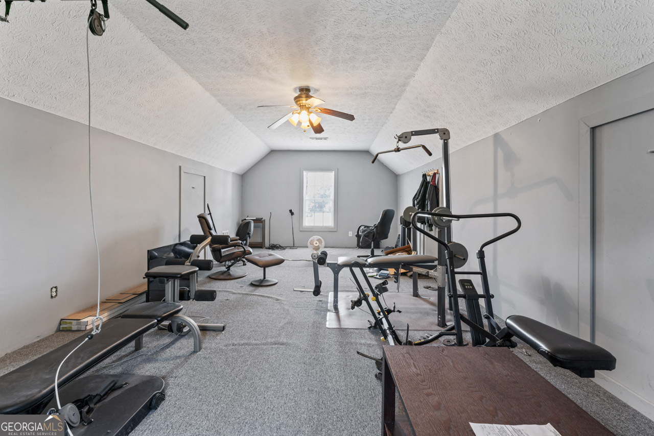 111 Cardell Farms Road Locust Grove, GA 30248 - Photo 34 of 37 a view of a room with gym equipment