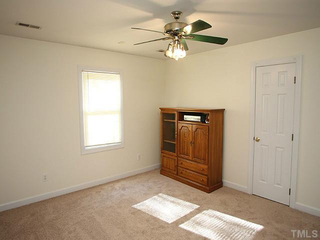 2504 Barton Ridge Court Raleigh, NC 27613 - Photo 16 of 25 Bedroom with carpeting, a ceiling fan and natural lighting. Bedroom