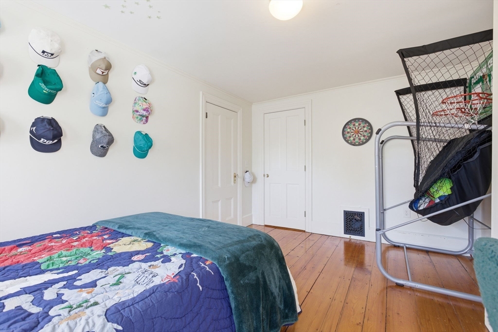 38 Bartlett Street Boston, MA 02129 - Photo 25 of 37 a bedroom with a bed and a window