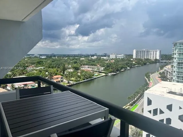 a view of a terrace with wooden floor and lake view