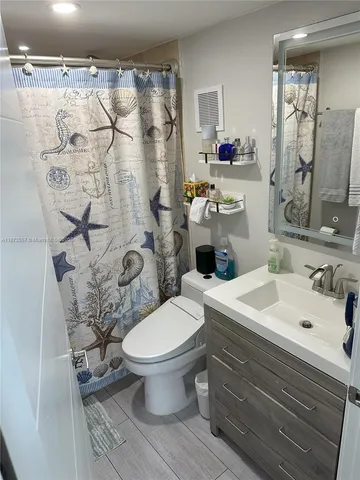 a view of a yard with wooden fence