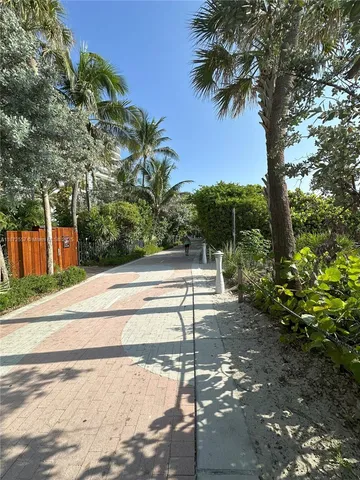 a bathroom with a double vanity sink mirror and shower