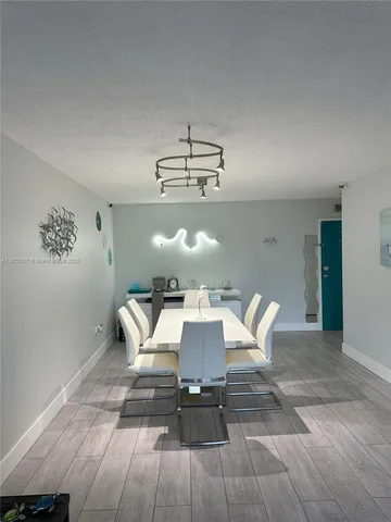 a kitchen with a sink stainless steel appliances and cabinets