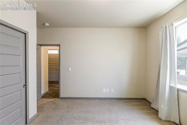 5126 Pring Ranch Road Colorado Springs, CO 80922 - Photo 20 of 32 Main-level bedroom