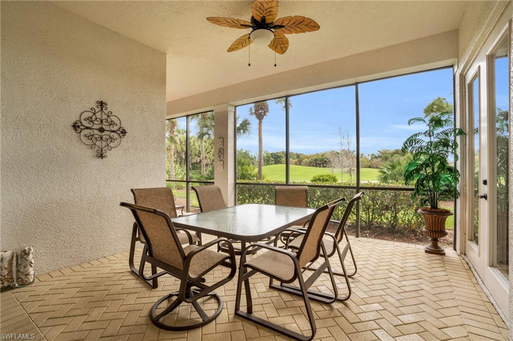 9006 Cascada Way, Unit 101 Naples, FL 34114 - Photo 7 of 25 a dining room with furniture window and wooden floor