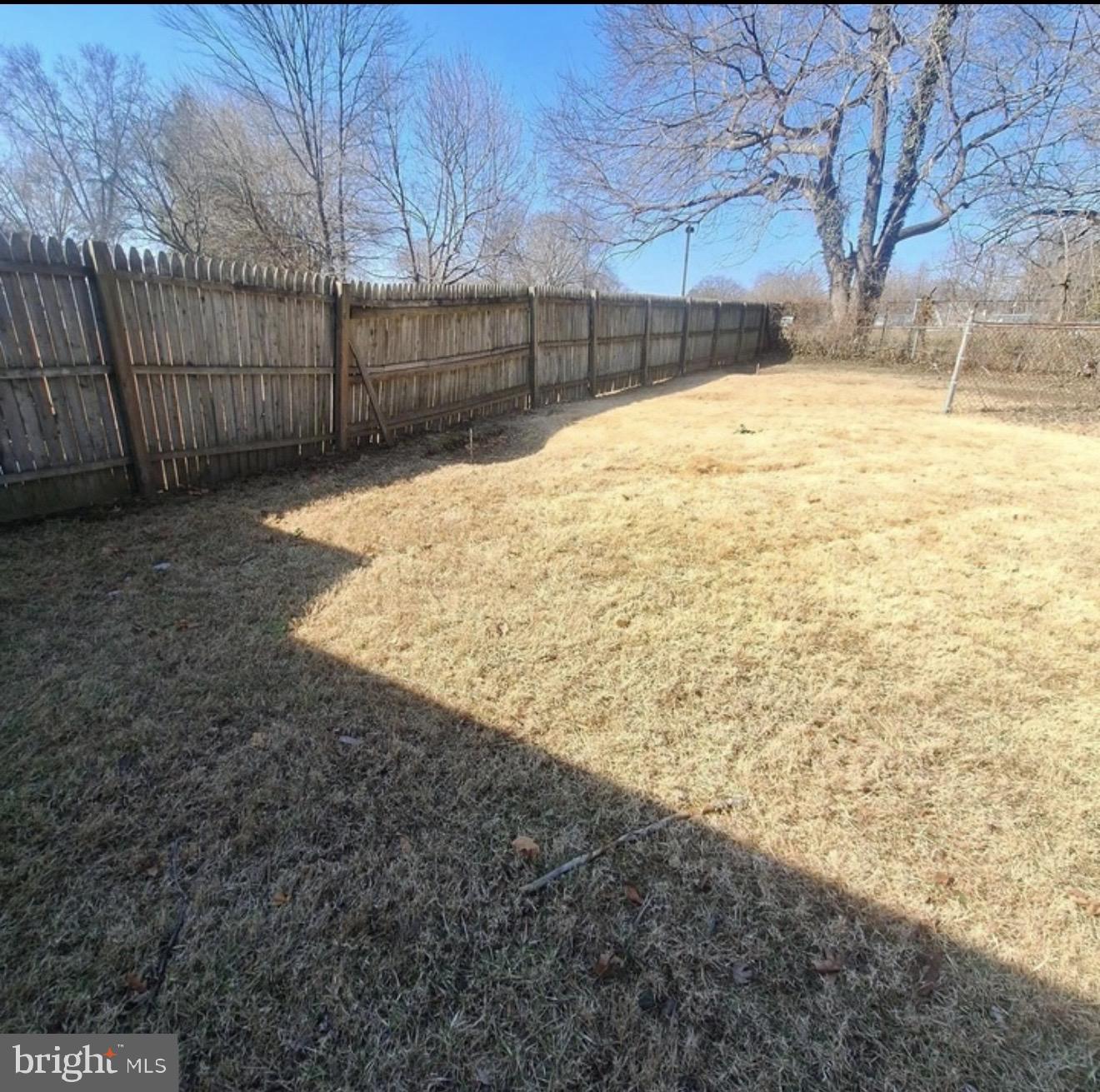 403 Trenton Court Wallingford, PA 19086 - Photo 11 of 11 a view of a yard with wooden fence