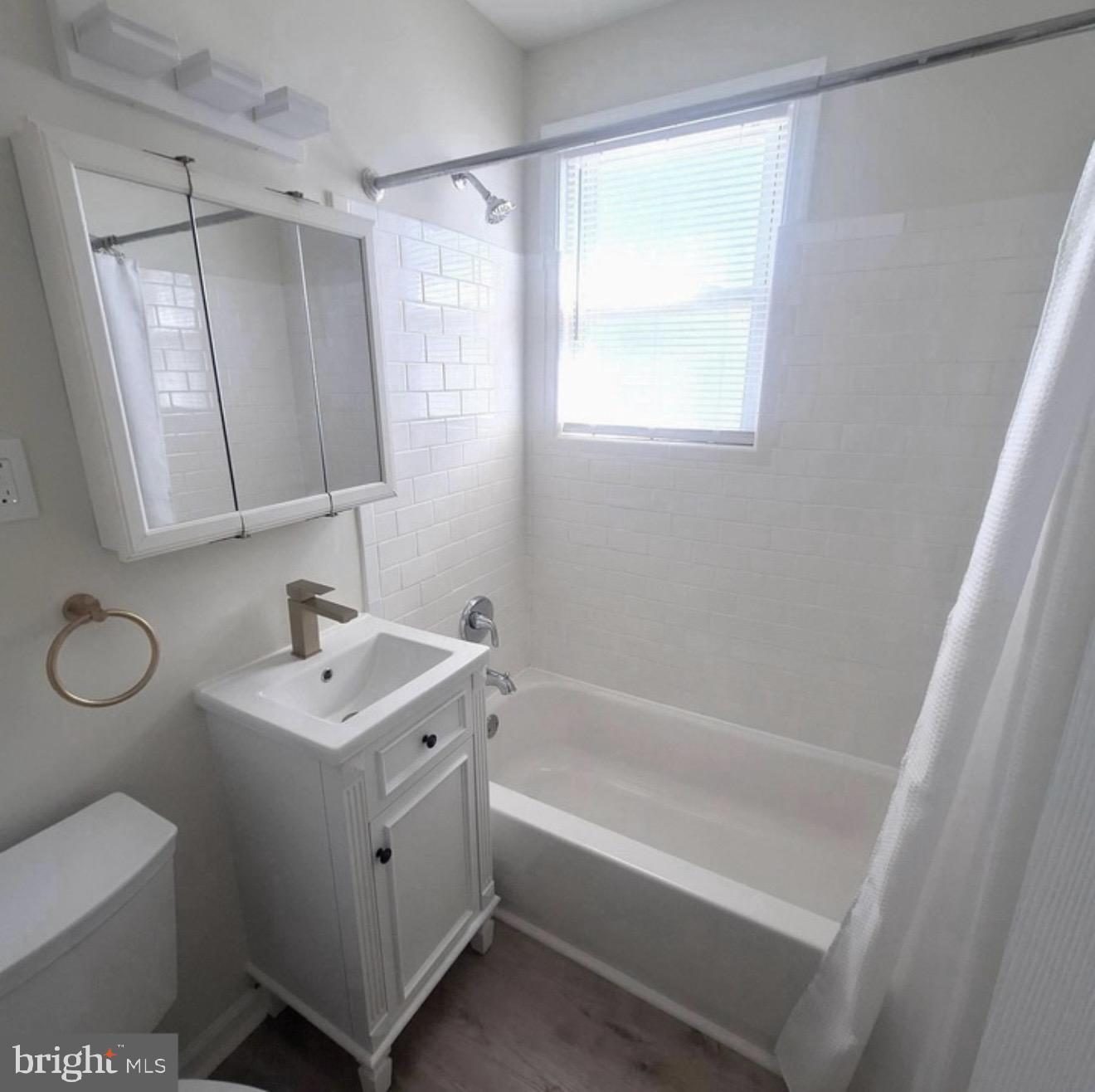 403 Trenton Court Wallingford, PA 19086 - Photo 9 of 11 a bathroom with a sink a toilet and a bathtub