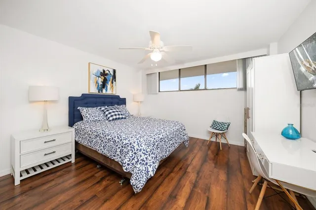 a bedroom with a bed and a table in it