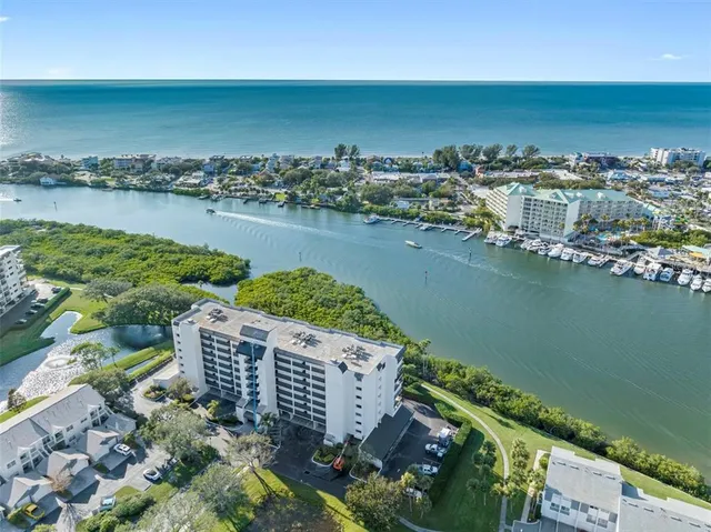 an aerial view of a city with ocean view