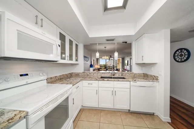 a kitchen with a sink cabinets and window