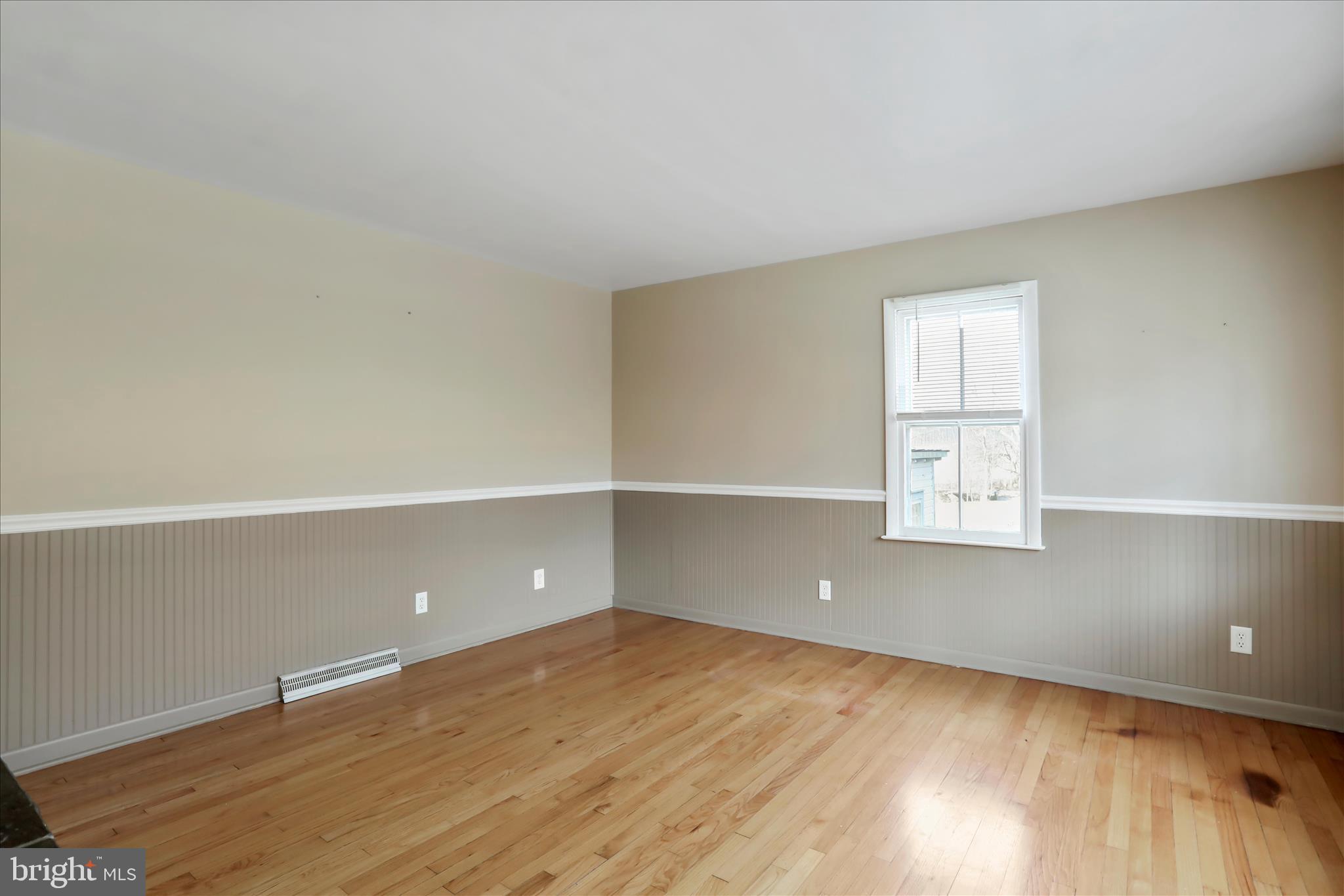 21938 Durberry Road Smithsburg, MD 21783 - Photo 11 of 55 an empty room with wooden floor and windows