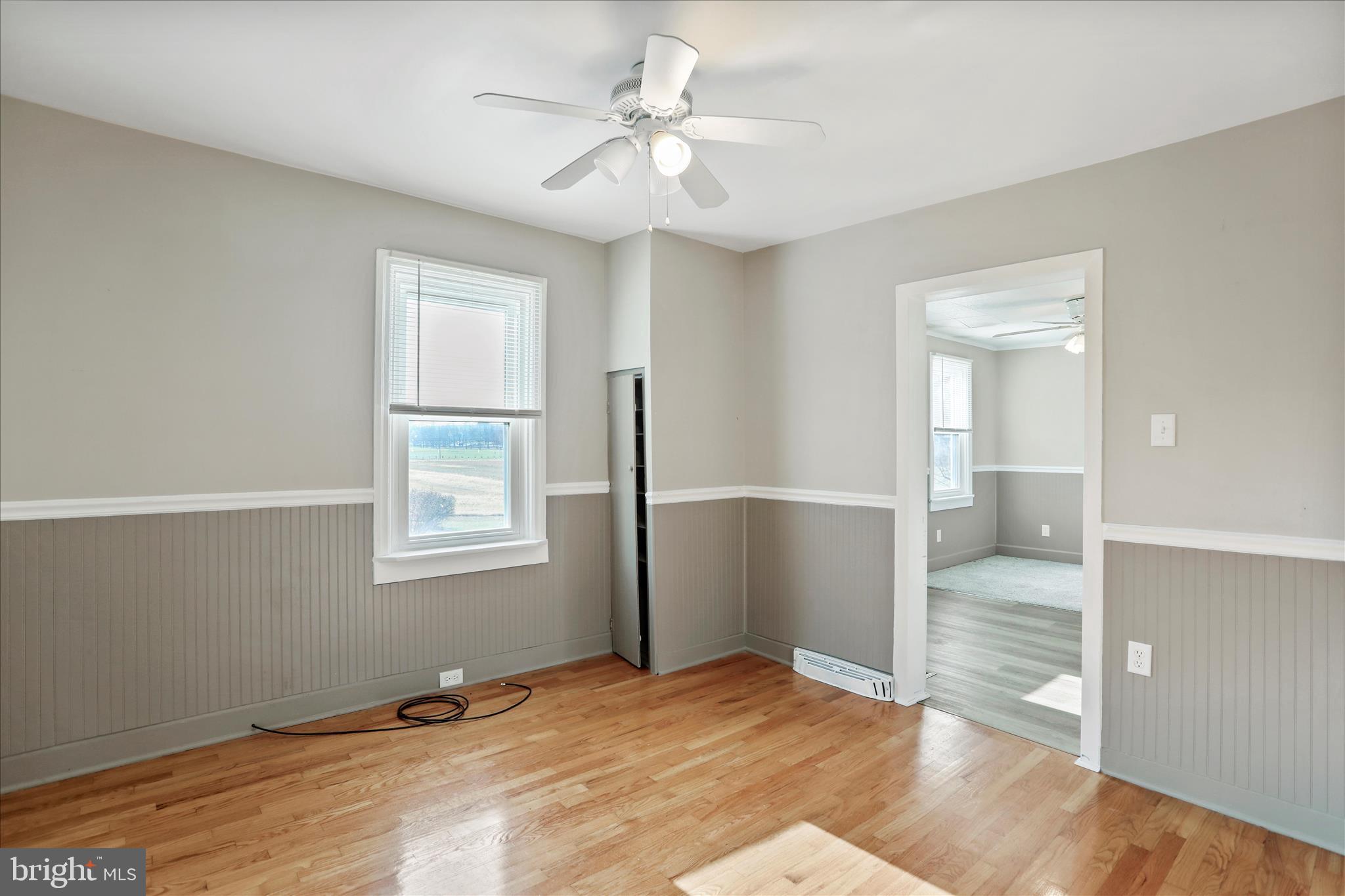 21938 Durberry Road Smithsburg, MD 21783 - Photo 12 of 55 wooden floor in an empty room with a window