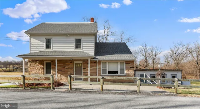 a front view of a house with a porch