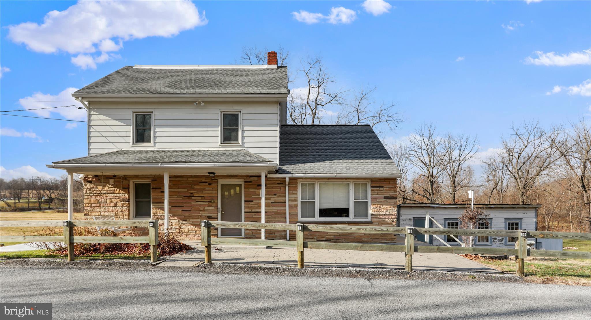 21938 Durberry Road Smithsburg, MD 21783 - Photo 2 of 55 a front view of a house with a porch