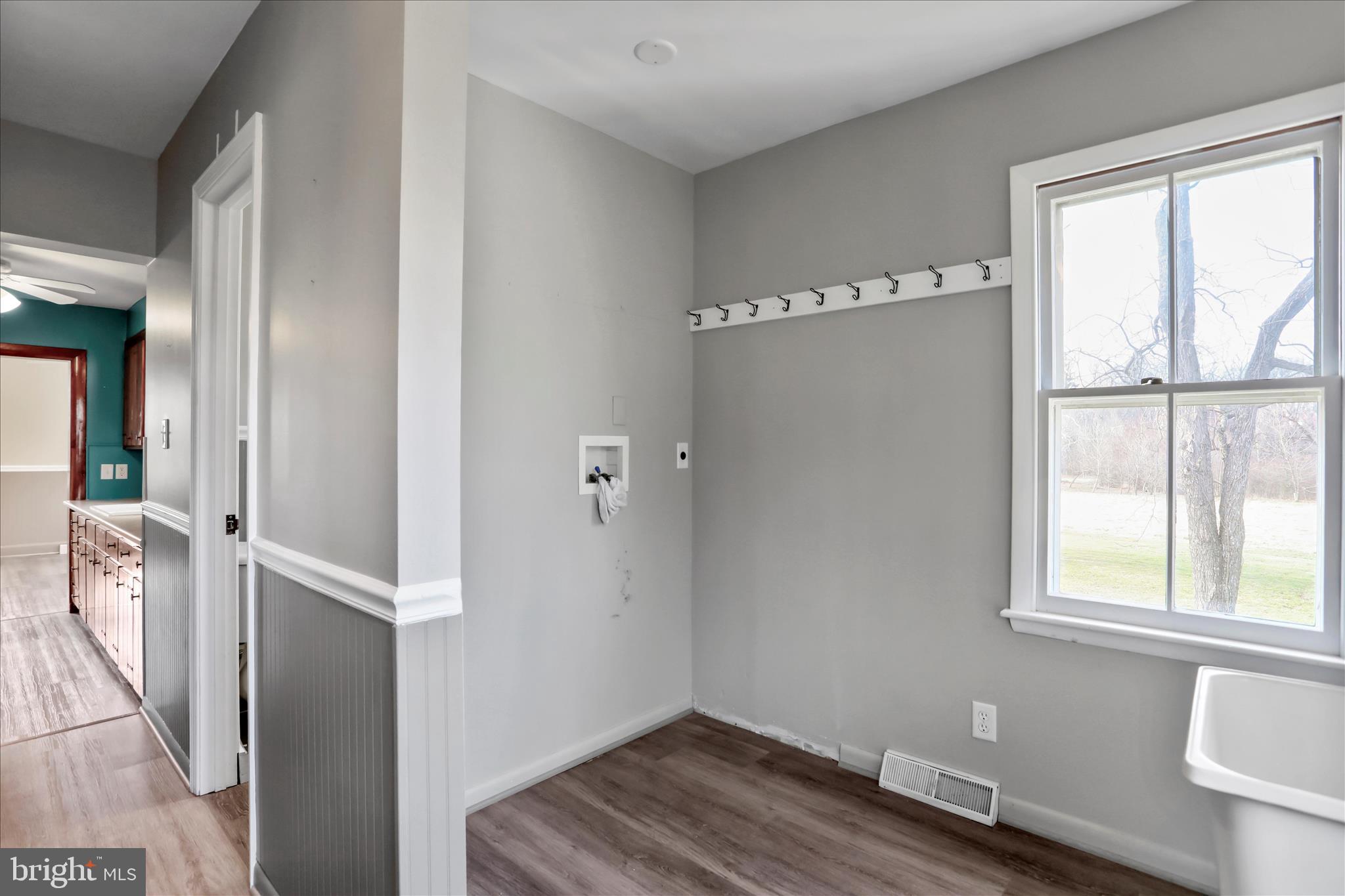 21938 Durberry Road Smithsburg, MD 21783 - Photo 21 of 55 a view of an empty room with wooden floor and a window