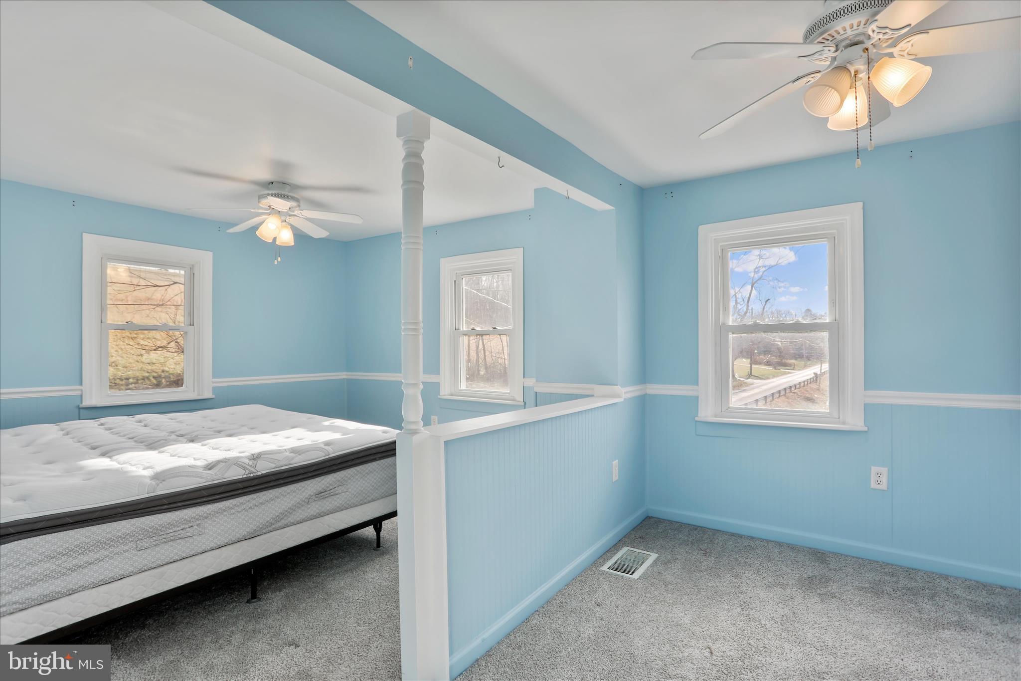 21938 Durberry Road Smithsburg, MD 21783 - Photo 22 of 55 a bedroom with a bed and a window