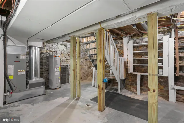 a view of white house with a yard covered in snow