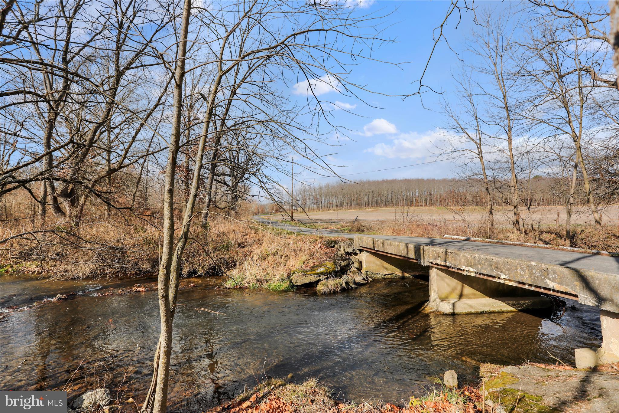 21938 Durberry Road Smithsburg, MD 21783 - Photo 50 of 55 a view of a lake with lawn chairs