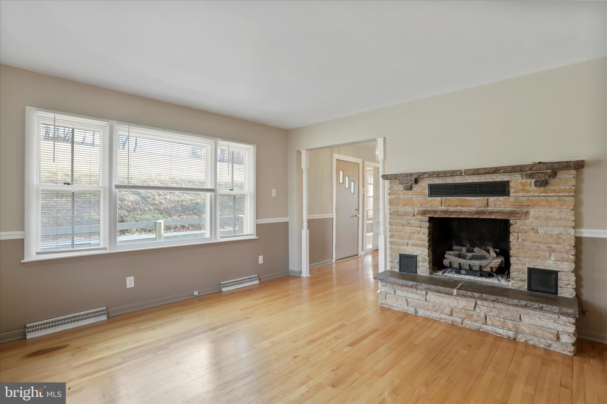 21938 Durberry Road Smithsburg, MD 21783 - Photo 10 of 55 an empty room with windows and fireplace