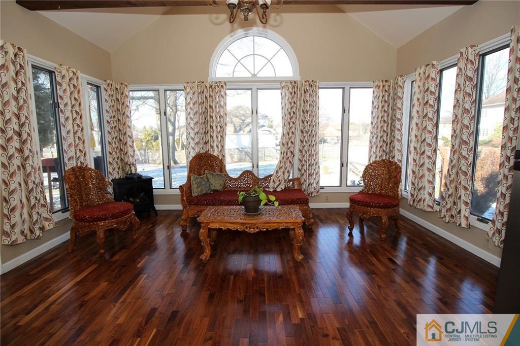 130 Ethel Road Edison, NJ 08817 - Photo 11 of 25 a living room with furniture and a large window