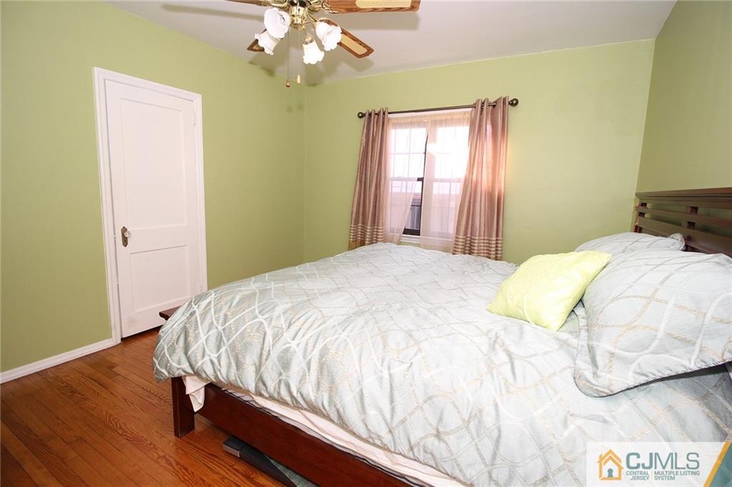 130 Ethel Road Edison, NJ 08817 - Photo 12 of 25 a bedroom with a bed and wooden floor
