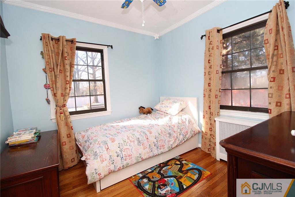 130 Ethel Road Edison, NJ 08817 - Photo 14 of 25 a bedroom with a bed and a window