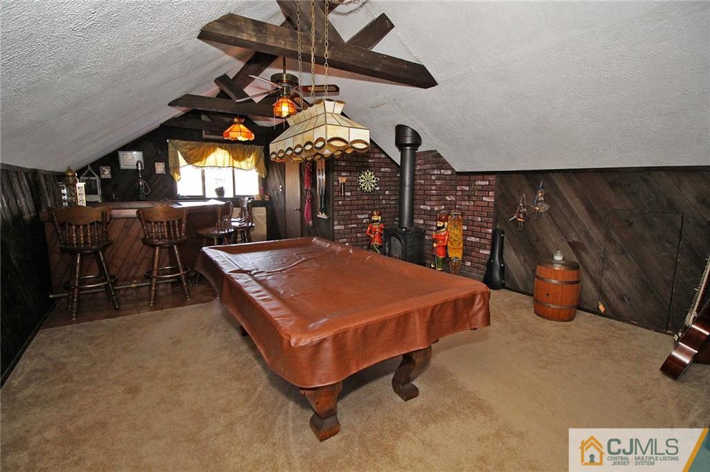 130 Ethel Road Edison, NJ 08817 - Photo 20 of 25 a living room with a flat screen tv and a table