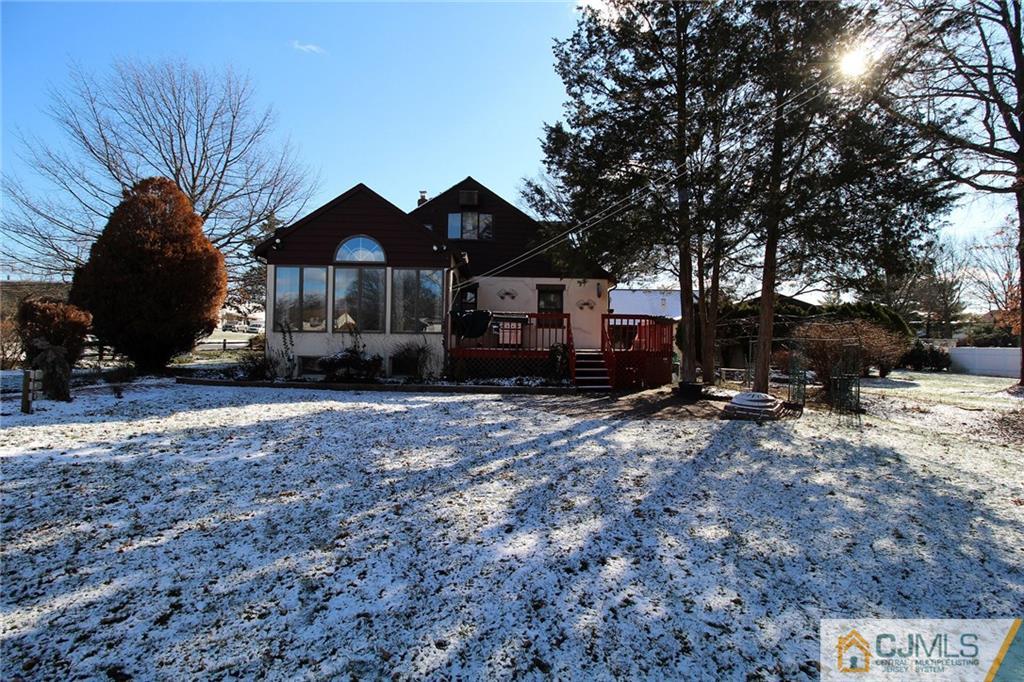 130 Ethel Road Edison, NJ 08817 - Photo 24 of 25 a front view of a house with a yard covered in snow