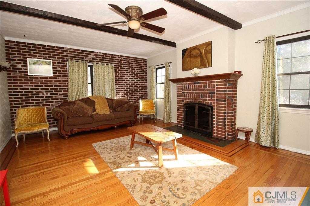 130 Ethel Road Edison, NJ 08817 - Photo 6 of 25 a living room with furniture and a fireplace