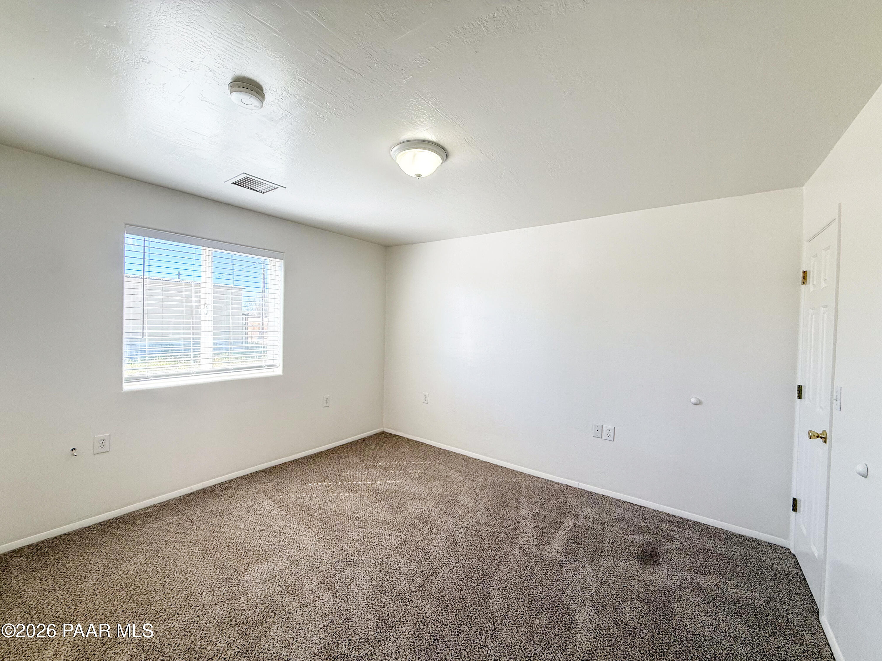 430 West Lake Louise Road Paulden, AZ 86334 - Photo 11 of 19 a view of an empty room with a window