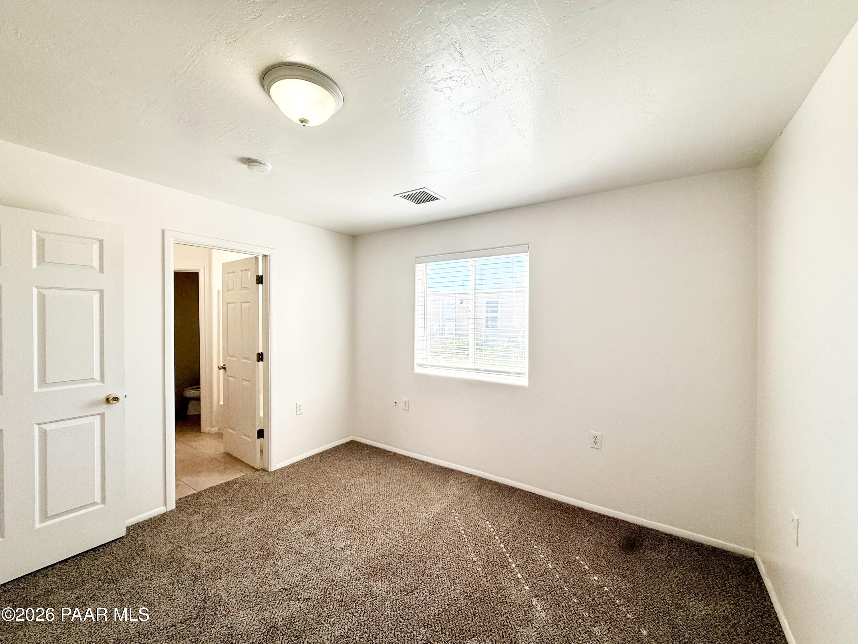 430 West Lake Louise Road Paulden, AZ 86334 - Photo 12 of 19 an empty room with windows