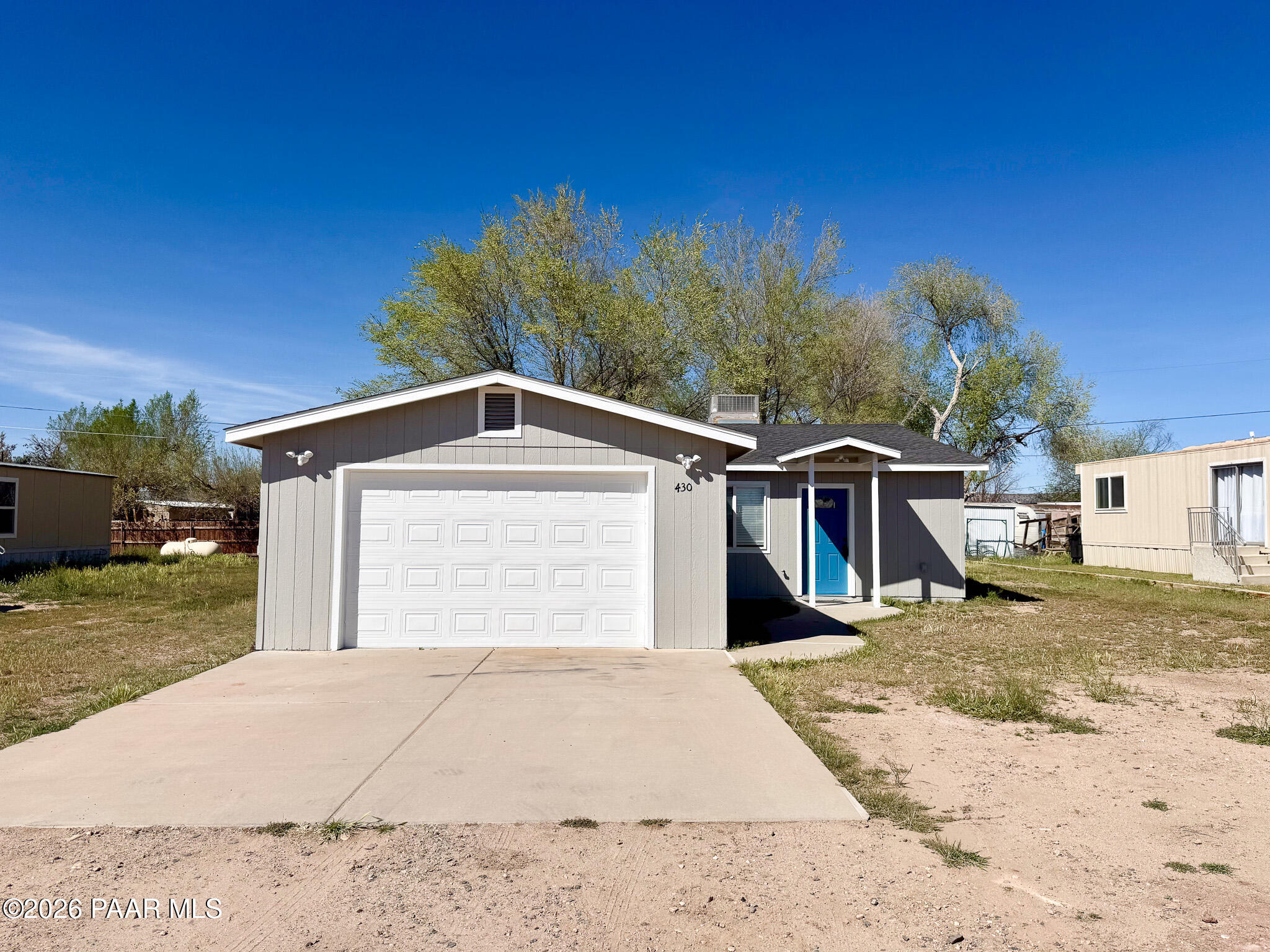 430 West Lake Louise Road Paulden, AZ 86334 - Photo 18 of 19 a front view of a house with a yard