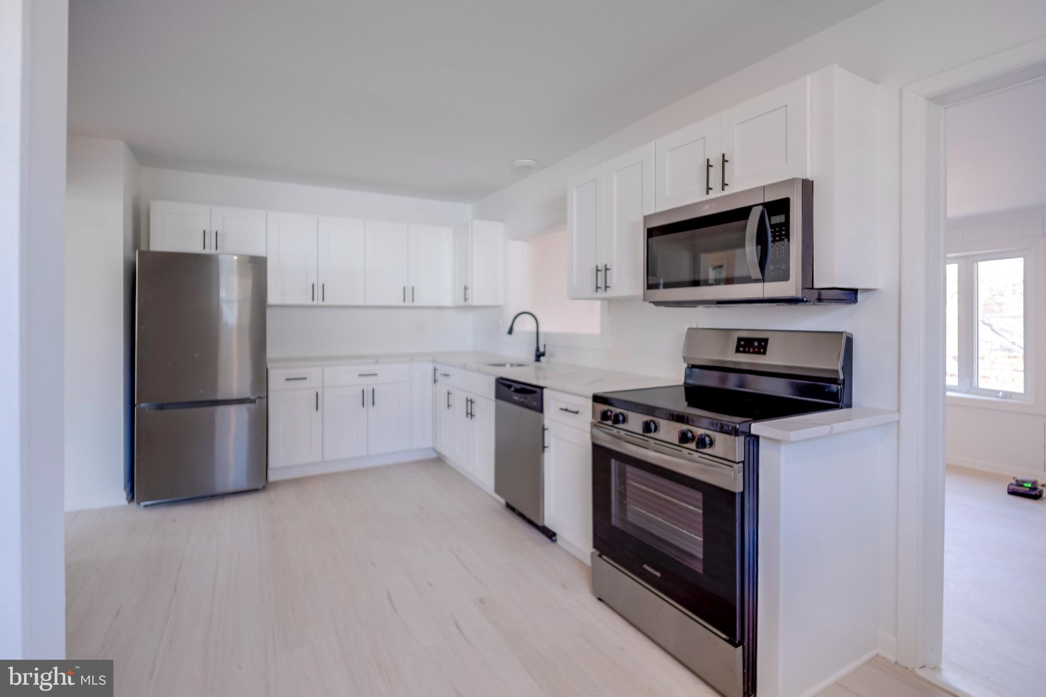 Modern kitchen with sleek appliances.