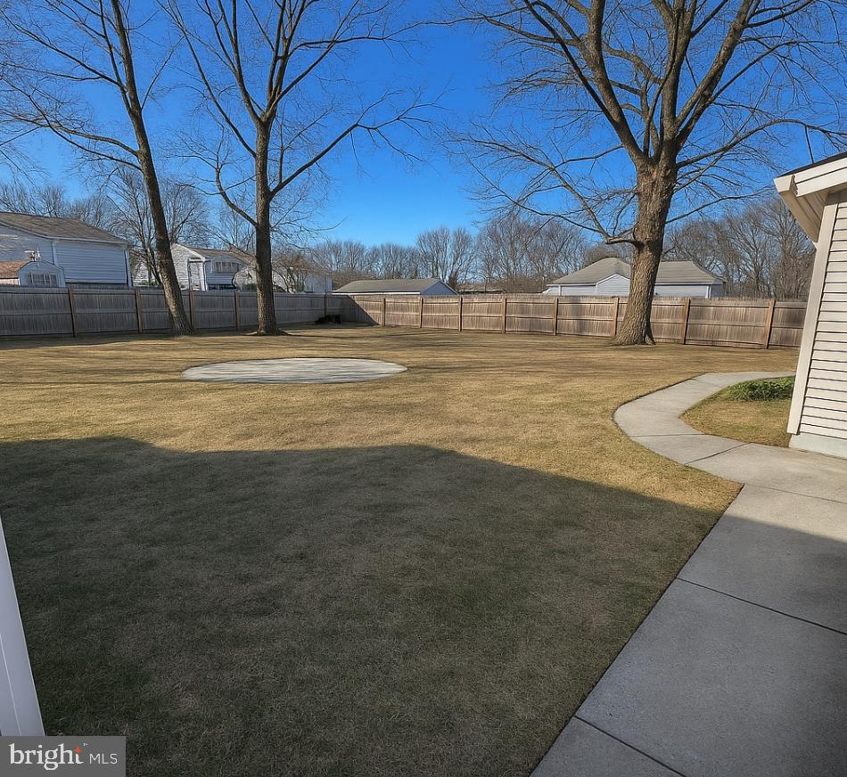1302 Edgewood Avenue Westville, NJ 08093 - Photo 16 of 16 a view of yard with swimming pool and large trees