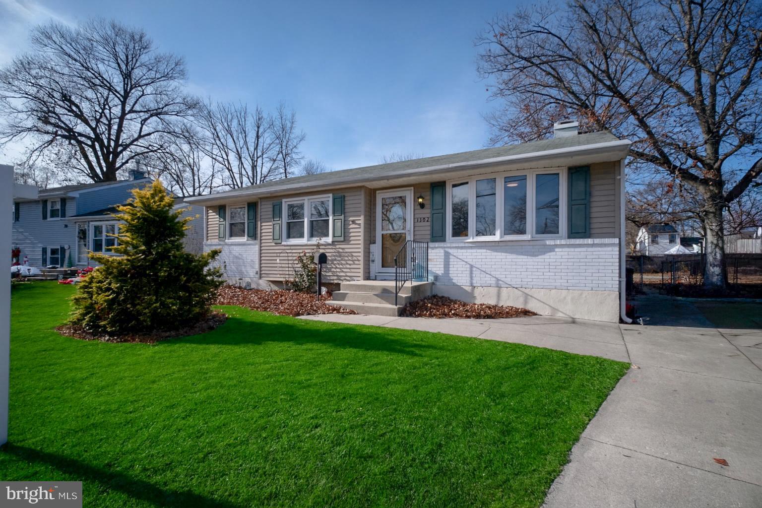 1302 Edgewood Avenue Westville, NJ 08093 - Photo 2 of 16 a front view of house with yard and green space