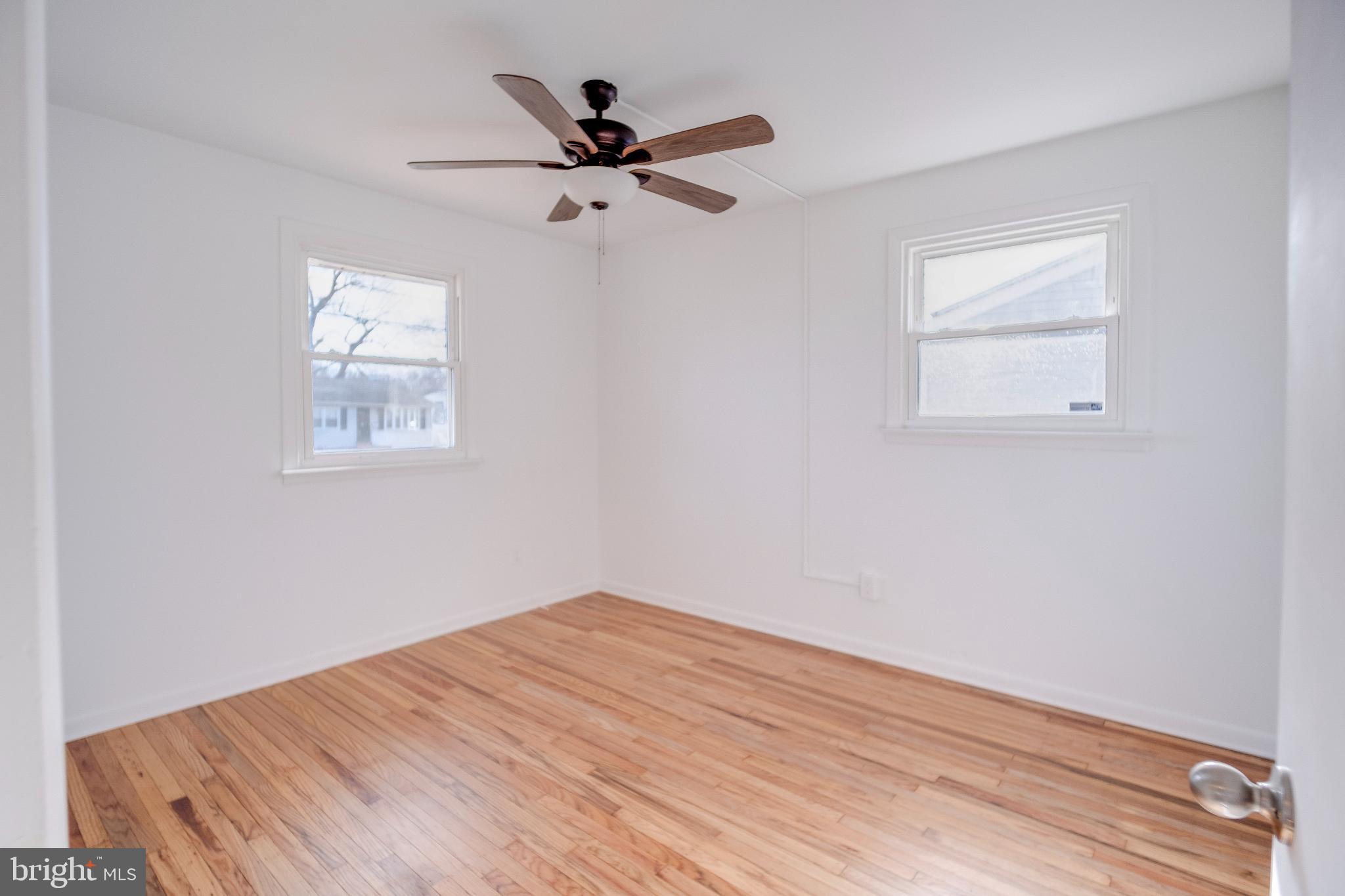 1302 Edgewood Avenue Westville, NJ 08093 - Photo 8 of 16 a view of a big room with wooden floor and windows