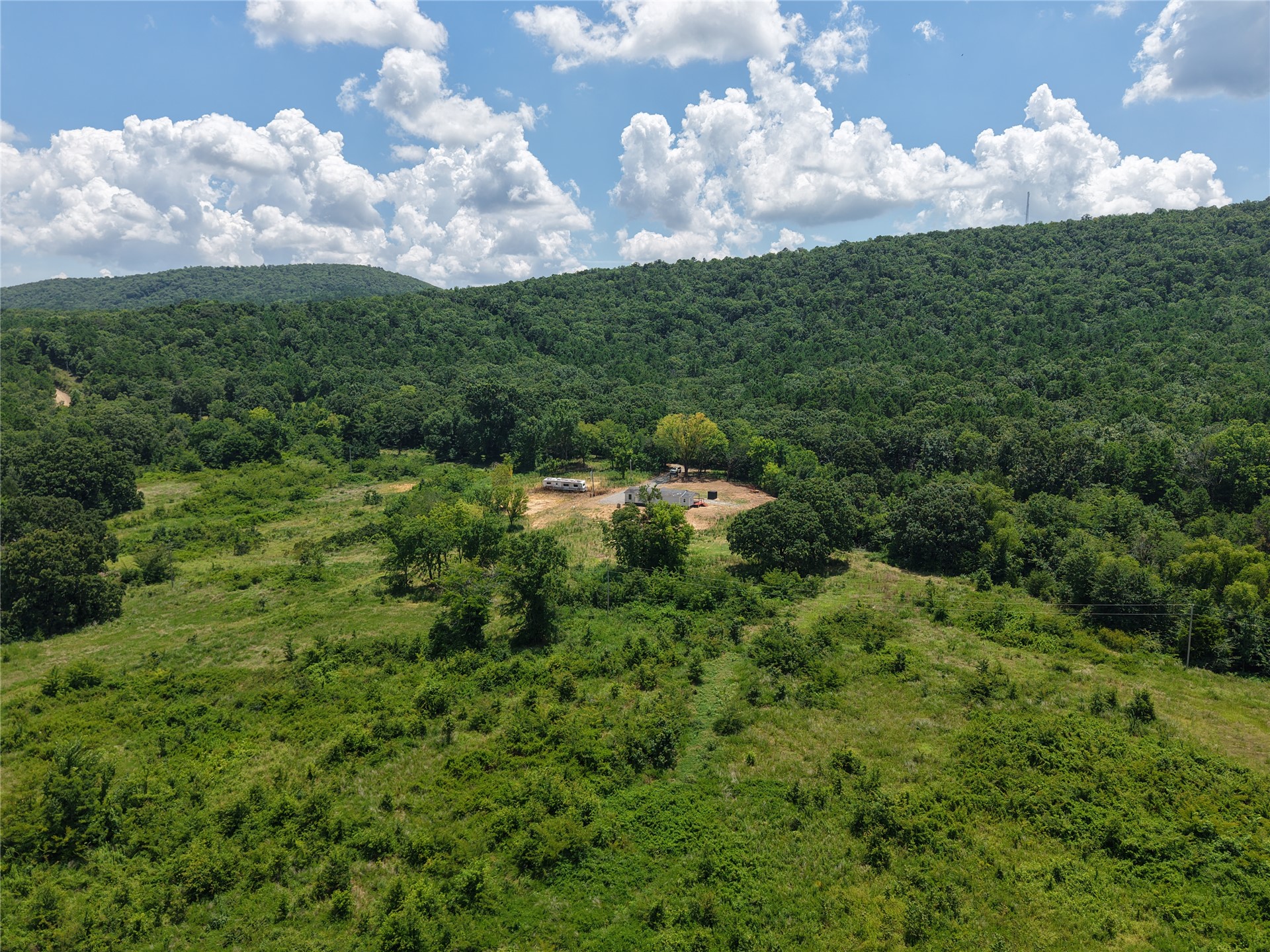 33594 Johnson Shady Point Shady Point, OK 74956 - Photo 17 of 18 Expansive land featuring a mix of open grassy areas and mature tree coverage