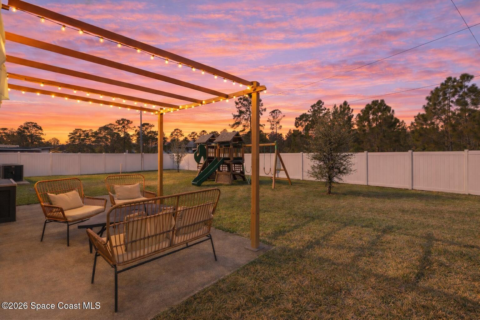 2926 Tishman Road Southeast Palm Bay, FL 32909 - Photo 28 of 29 Backyard Twilight