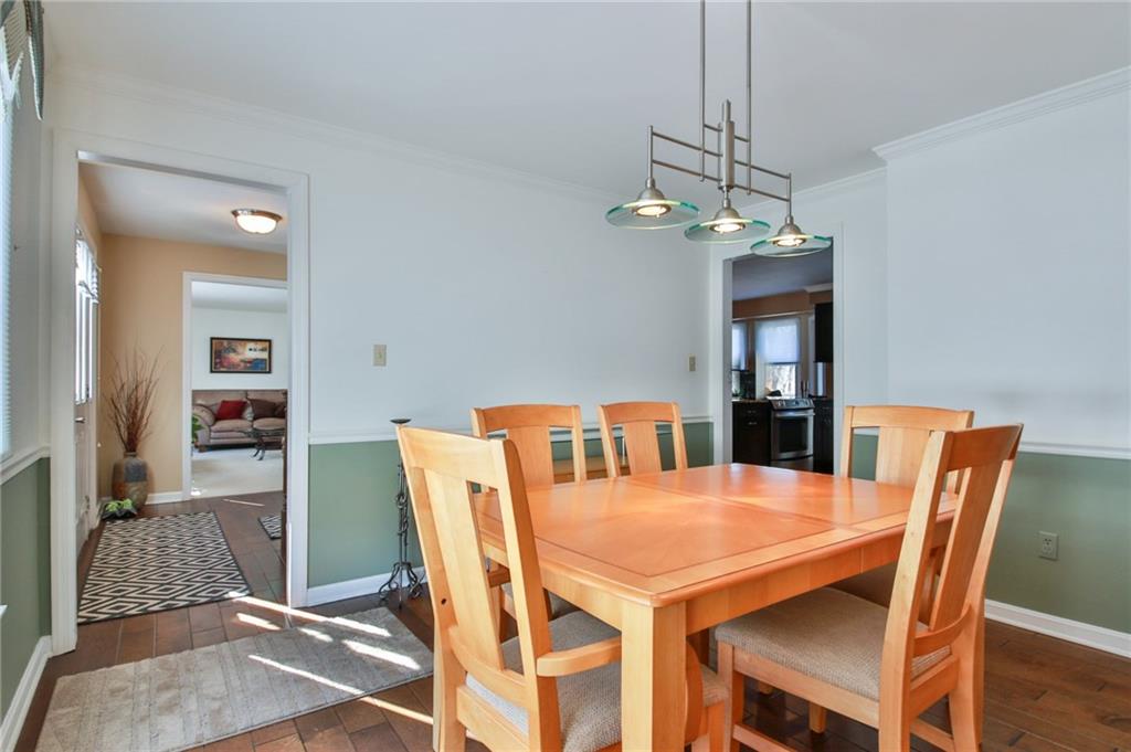 556 Center Church Road Canonsburg, PA 15317 - Photo 4 of 18 Beautiful hard wood floors, abundant natural light, and access to the kitchen from the dining room allows for entertaining family and friends for a dinner party.