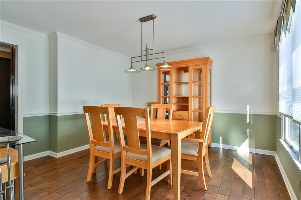 556 Center Church Road Canonsburg, PA 15317 - Photo 5 of 18 Beautiful hard wood floors, abundant natural light, and access to the kitchen from the dining room allows for entertaining family and friends for a dinner party.