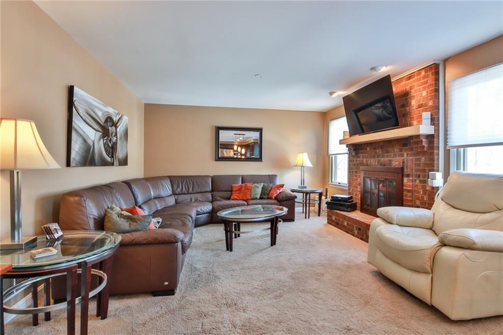 556 Center Church Road Canonsburg, PA 15317 - Photo 6 of 18 Relax next to the gas fireplace in the beautiful living room highlighted with its large brick fireplace.