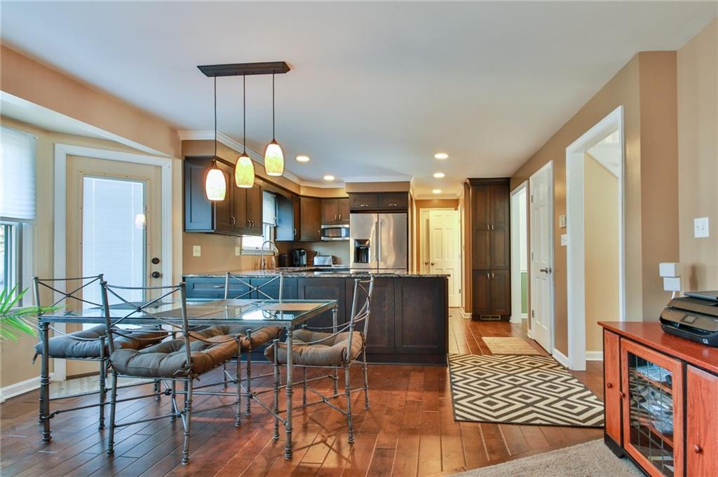 556 Center Church Road Canonsburg, PA 15317 - Photo 8 of 18 Beautiful hard wood floors, abundant natural light, and access doors from the dining area to the large deck will allow for easy outdoor dining and entertaining!