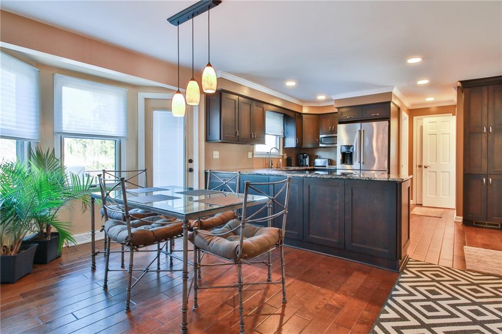 556 Center Church Road Canonsburg, PA 15317 - Photo 9 of 18 Beautiful hard wood floors, abundant natural light, and access doors from the dining area to the large deck will allow for easy outdoor dining and entertaining!