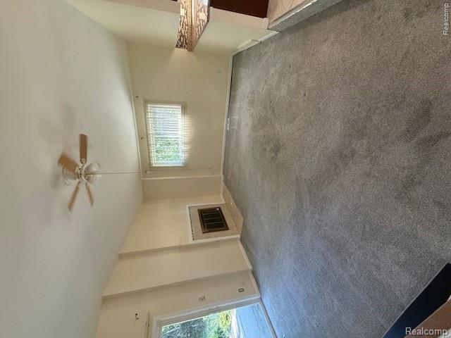 43038 Hanford Road Canton, MI 48187 - Photo 19 of 36 Living area featuring gray carpeting, a built-in fireplace with a tile surround, a ceiling fan with integrated lighting, and a sliding glass door
