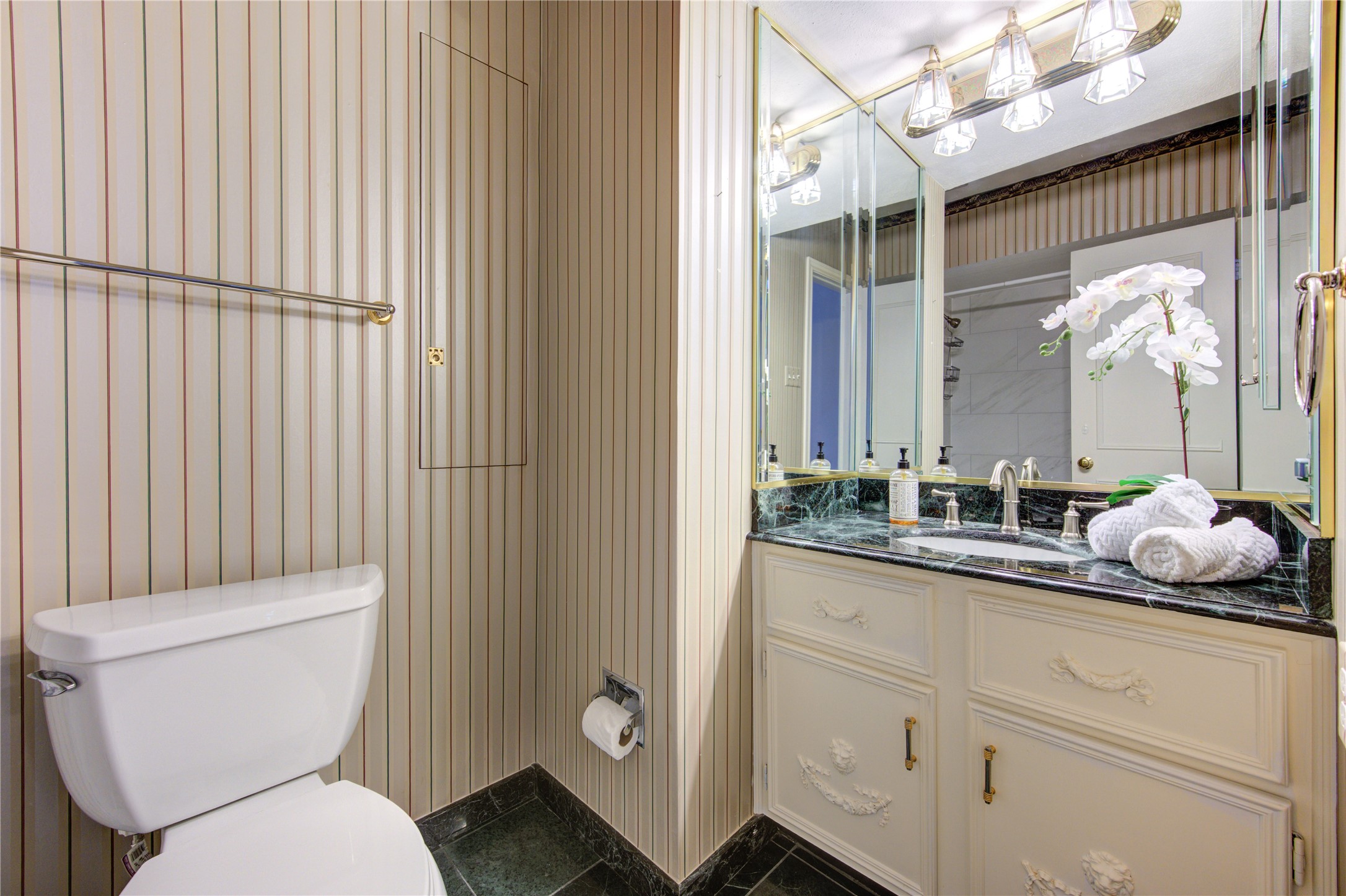 2232 South Piney Point Road, Unit 110 Houston, TX 77063 - Photo 14 of 21 Stylish secondary bathroom featuring elegant vanity cabinetry, marble-style countertops, designer lighting, and updated finishes that create a bright and polished guest retreat.