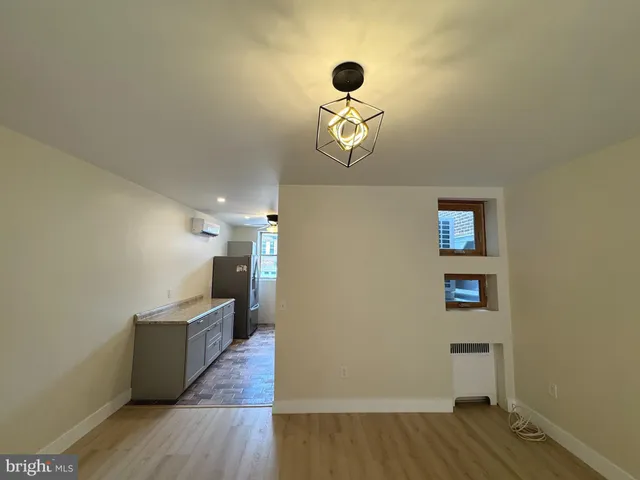 a view of a room with wooden floor and staircase