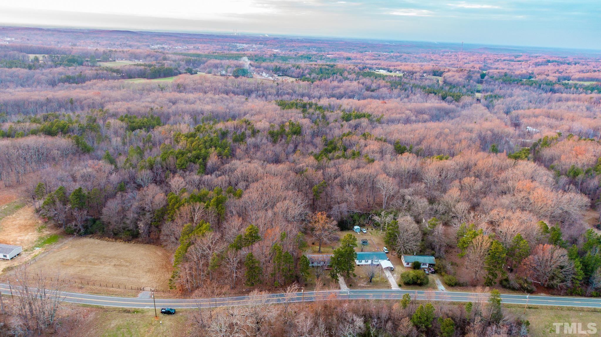 69.58-acres Mountain Road Roxboro, NC 27574 - Photo 3 of 10 an aerial view of residential houses with outdoor space