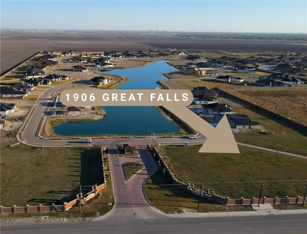 an aerial view of a house with a ocean view